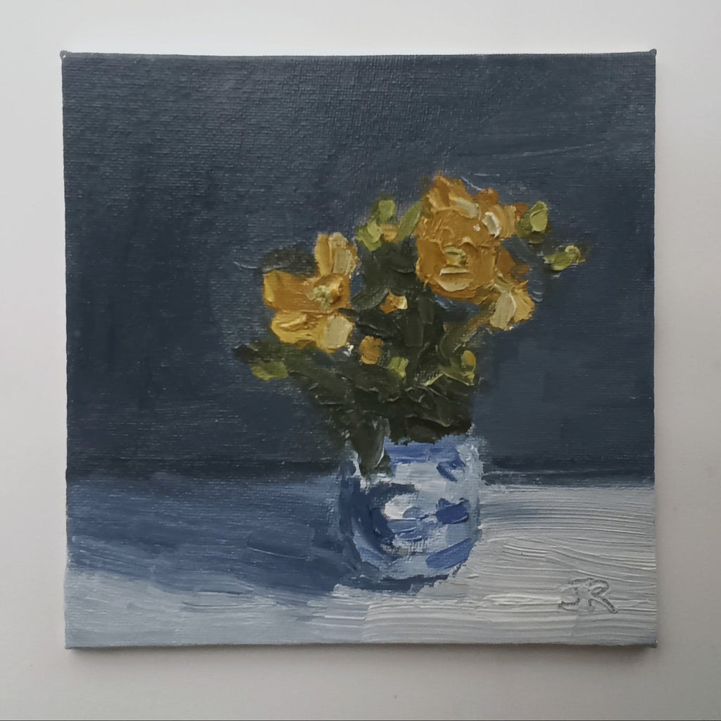 Yellow Flowers in a Blue Pot