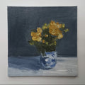 Yellow Flowers in a Blue Pot